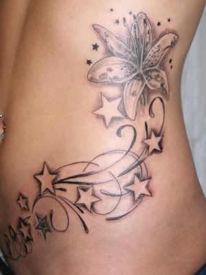 tattoos of flowers on hip. flower hip tattoos. flower