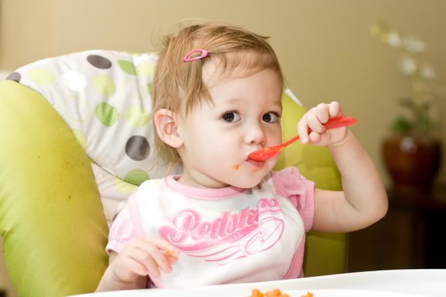 photography of child eating meal